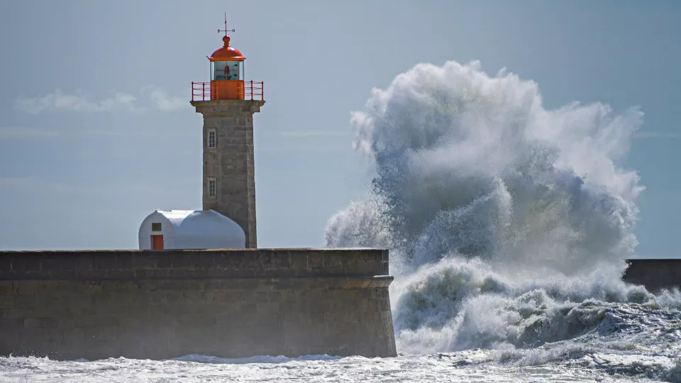 A lighthouse on a pier.