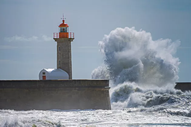 A lighthouse on a pier.