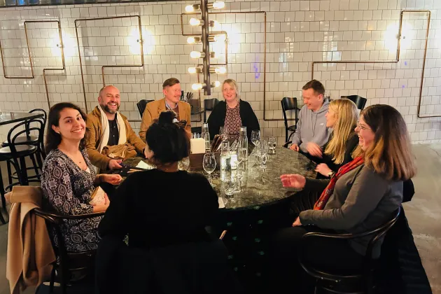 participants in the course joined around dinner table