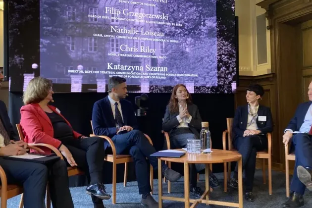 Participants in conference on stage