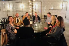 participants in the course joined around dinner table